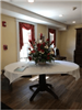 Welcoming Entrance and Large Table with Flower Arrangement