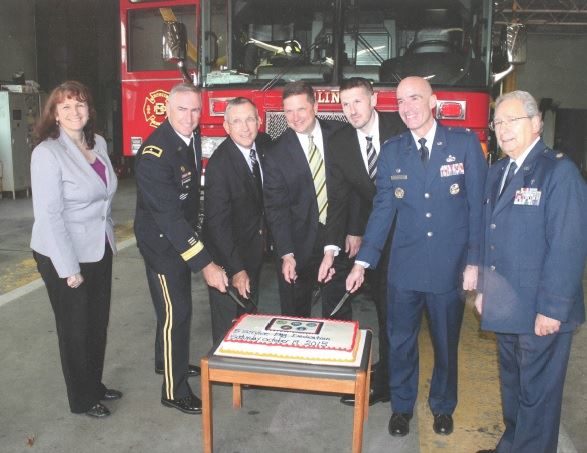 Guest Speakers Cutting the Celebratory Cake